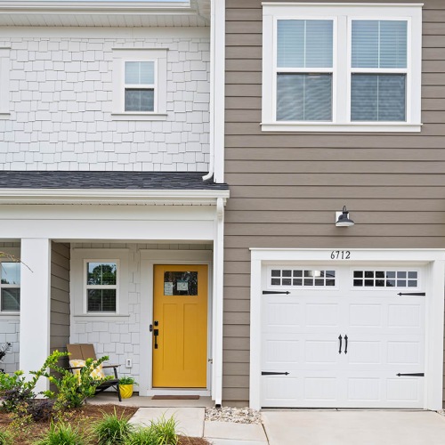 Exterior of luxury townhomes with garages for rent in Charlotte, NC at Oak Lake